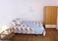 A bed or beds in a room at Sea & Wave Don Cristian Apartment