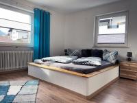 A bed or beds in a room at Ferienwohnung Sunhill