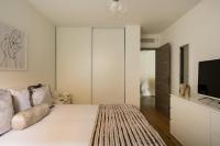 A bed or beds in a room at Stylish New 1 bedroom apartment in juan les pins
