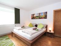 Łóżko lub łóżka w pokoju w obiekcie Apartment Am Ziller by Interhome