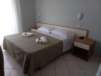 Posteľ alebo postele v izbe v ubytovaní Hotel Venere