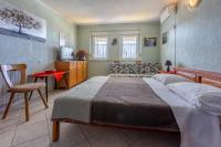 Posteľ alebo postele v izbe v ubytovaní Apartmani ELLEN