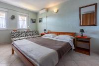 Posteľ alebo postele v izbe v ubytovaní Apartmani ELLEN