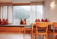 a room with a window seat with a table and chairs at Bonawinkel NEU in Gaschurn