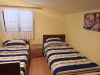 Postel nebo postele na pokoji v ubytování Apartman Zlata