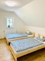 Postel nebo postele na pokoji v ubytování Apartmány Jetřichovice - České Švýcarsko