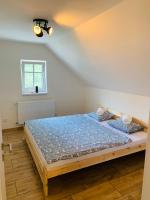 Postel nebo postele na pokoji v ubytování Apartmány Jetřichovice - České Švýcarsko