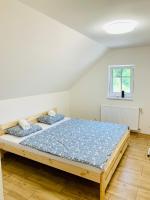 Postel nebo postele na pokoji v ubytování Apartmány Jetřichovice - České Švýcarsko