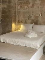 Posteľ alebo postele v izbe v ubytovaní La Cammara al Duomo Lecce Luxury Apartment
