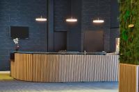 an office lobby with a reception desk with at Sure Hotel by Best Western Nantes Beaujoire in Nantes