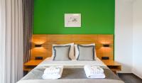 A bed or beds in a room at Botanica Luxury Suites