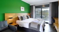 A bed or beds in a room at Botanica Luxury Suites