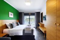A bed or beds in a room at Botanica Luxury Suites