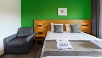 A bed or beds in a room at Botanica Luxury Suites