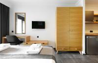 A bed or beds in a room at Botanica Luxury Suites