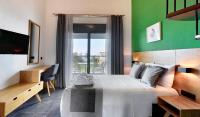 A bed or beds in a room at Botanica Luxury Suites