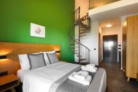 A bed or beds in a room at Botanica Luxury Suites