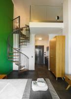 A bed or beds in a room at Botanica Luxury Suites