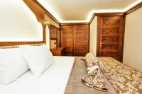 Postel nebo postele na pokoji v ubytování Kumluk Konak Hotel