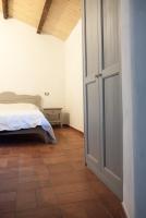 A bed or beds in a room at Agriturismo Mirasole