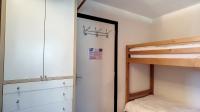 a bedroom with a bunk bed and a closet at STUDIO LUMINEUX -SAINT JEAN D&#39;AULPS STATION - 5 Personnes- RELAIS S29 in Saint-Jean-d&#39;Aulps
