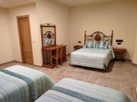 Postel nebo postele na pokoji v ubytování Hotel Novo