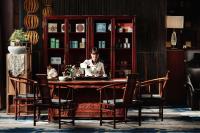 a woman sitting at a table in a room at Park Plaza Beijing Wangfujing in Beijing
