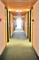 a hallway of an office building with a long corridor at Mister Bed Chambray Les Tours in Chambray-lès-Tours