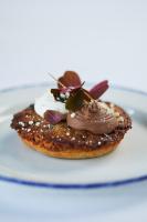 a plate with a pancake with chocolate on it at Stevns Klint Strandpension in Rødvig