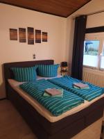 Postel nebo postele na pokoji v ubytování Ferienhaus Bella