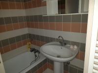 a bathroom with a sink and a bath tub at Gite de Bénédicte Mouton in Colmar