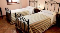 A bed or beds in a room at B&B Mela