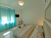 Postel nebo postele na pokoji v ubytování Villa Markulin, Šišan