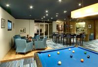 a billiard room with a pool table and a bar at Radisson BLU Balmoral in Spa