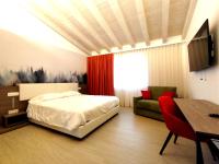 Łóżko lub łóżka w pokoju w obiekcie Hotel Luna