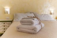 A bed or beds in a room at Alghero Roof Garden