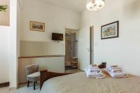A bed or beds in a room at Alghero Roof Garden