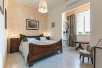 A bed or beds in a room at Alghero Roof Garden