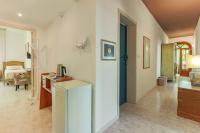 A bed or beds in a room at Alghero Roof Garden