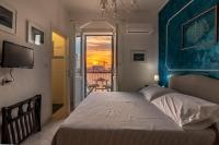 A bed or beds in a room at Alghero Roof Garden