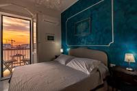 A bed or beds in a room at Alghero Roof Garden