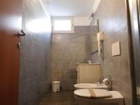 Kúpeľňa v ubytovaní Gabbiano Apartments