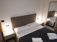 Posteľ alebo postele v izbe v ubytovaní Gabbiano Apartments