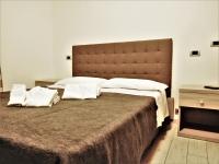 Posteľ alebo postele v izbe v ubytovaní Gabbiano Apartments