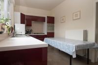 a kitchen with a counter with a table in it at Huize Porteman in Staden