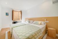 Łóżko lub łóżka w pokoju w obiekcie Petit Biniaraix - Ex Menditzu Rooms