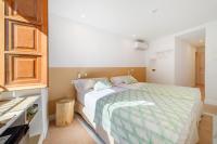 Łóżko lub łóżka w pokoju w obiekcie Petit Biniaraix - Ex Menditzu Rooms