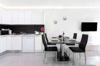 A kitchen or kitchenette at Manuda Luxury Apartment