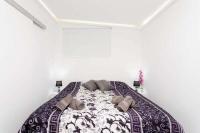 A bed or beds in a room at Manuda Luxury Apartment