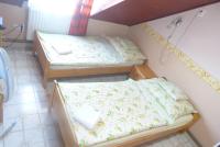 Postel nebo postele na pokoji v ubytování Família Panzió